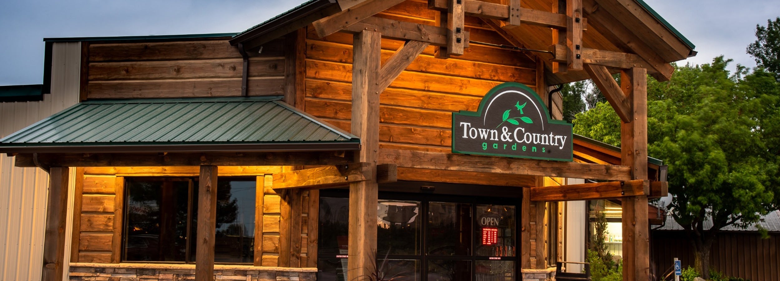 Town & Country Gardens storefront in Idaho Falls with rustic wood exterior and welcoming garden center entrance